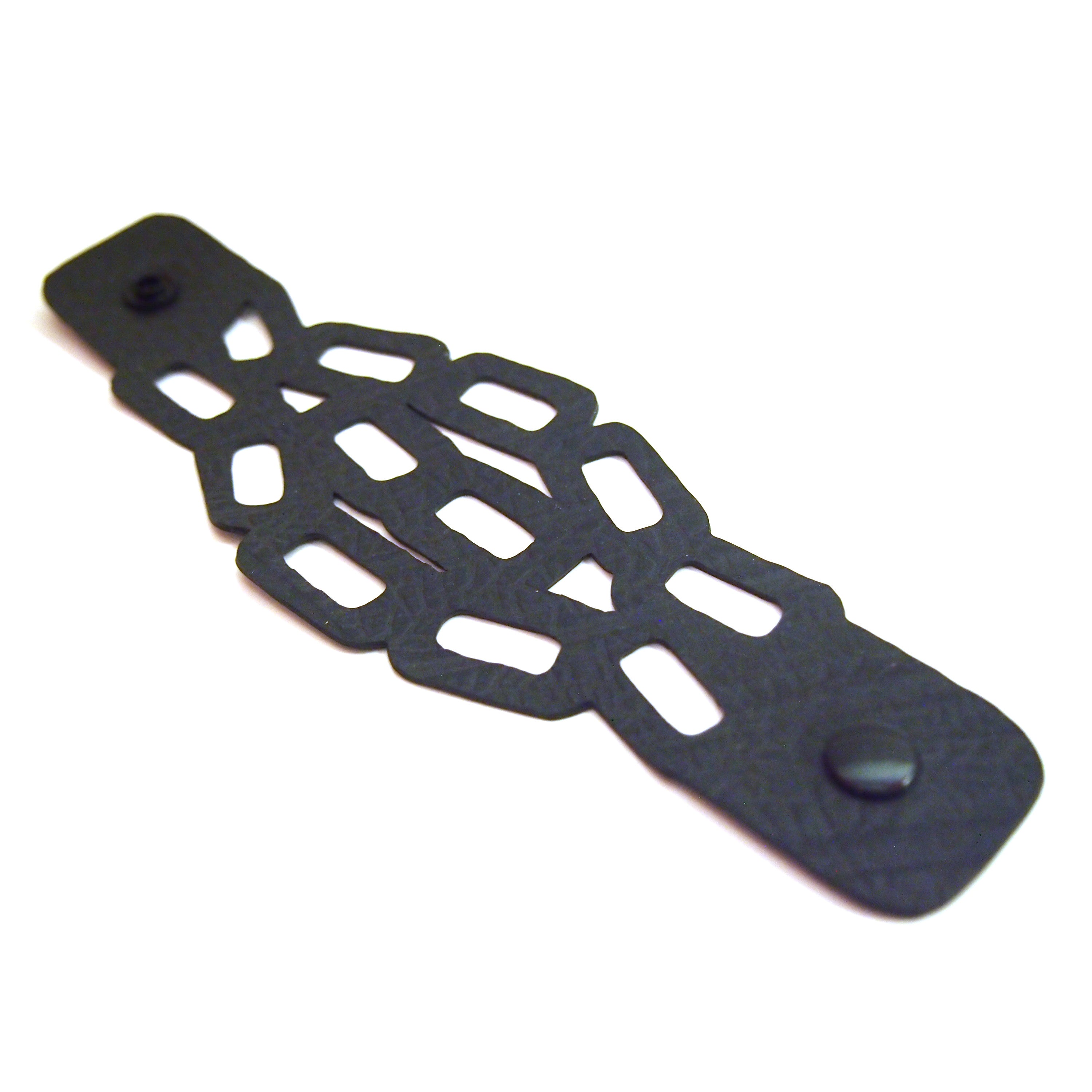Paguro Upcycle black eco friendly chain bracelet with geometric cutout design and snap closure