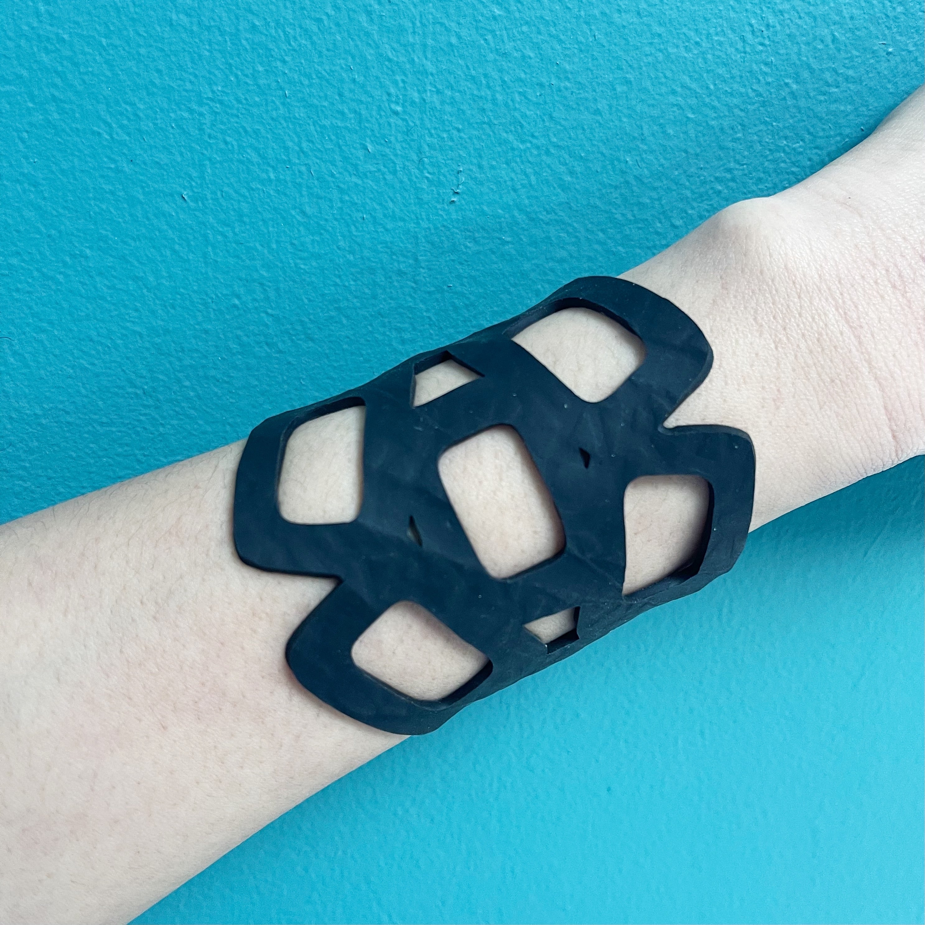 Paguro Upcycle black eco friendly chain bracelet with geometric open links on wrist