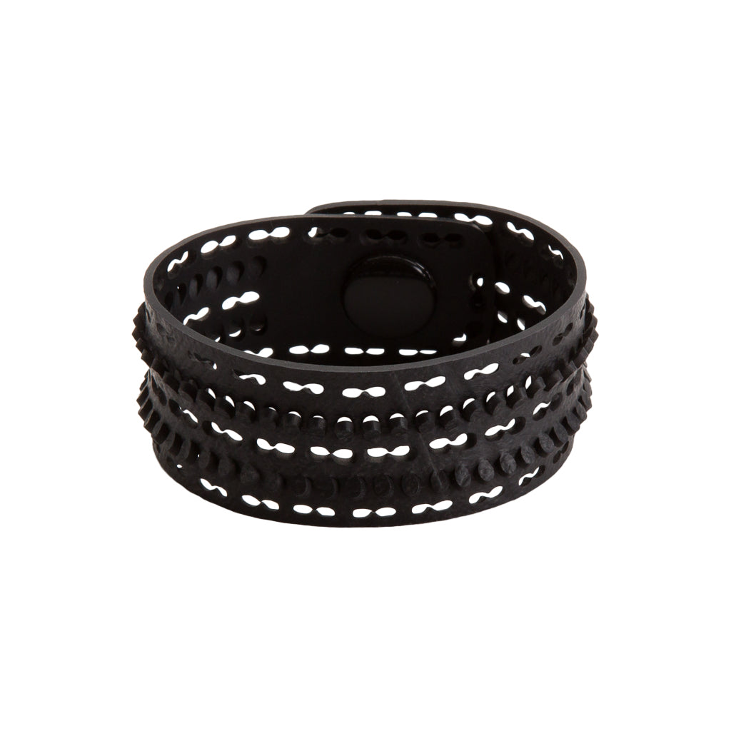 Paguro Upcycle black recycled rubber bracelet with textured design and button closure