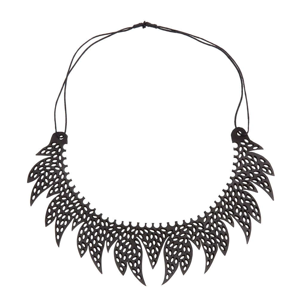 Paguro Upcycle black upcycled inner tube necklace with intricate cut-out leaf design and adjustable cord