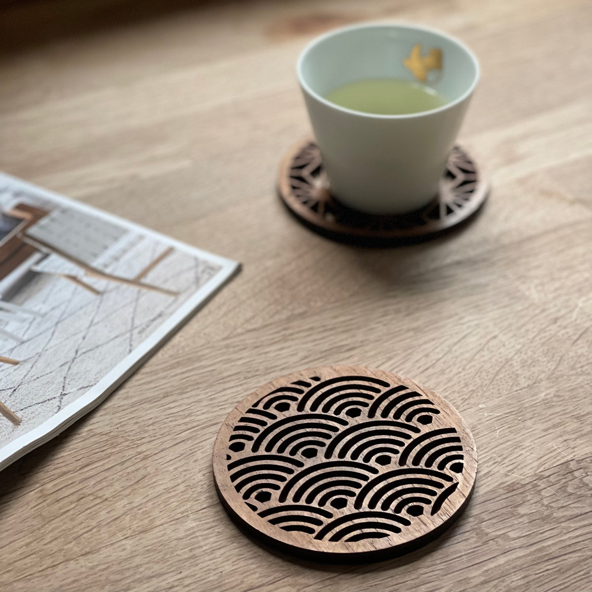 Handmade Japanese wave pattern coasters made from reclaimed teak wood by Paguro Upcycle