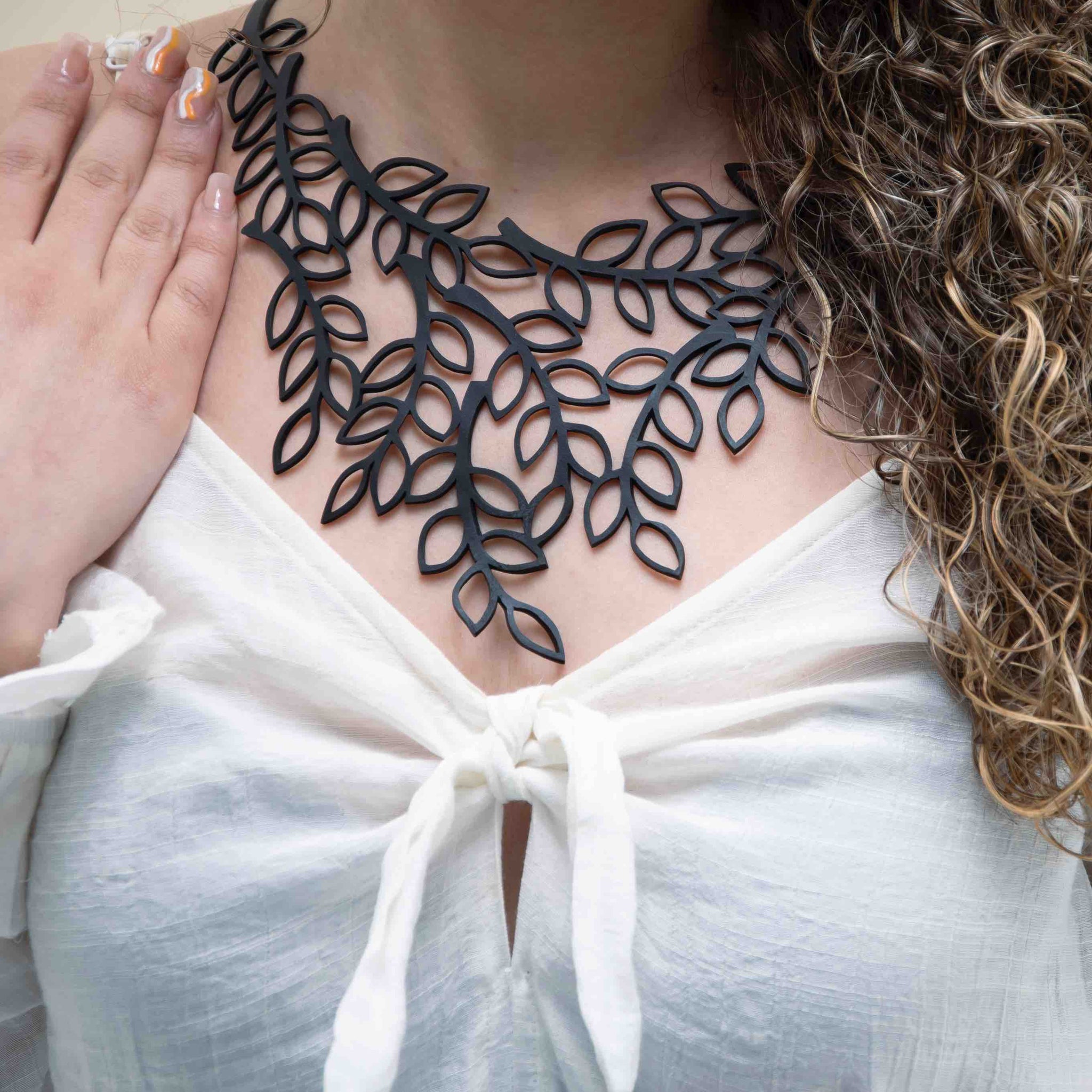 Laser cut hot sale rubber necklace