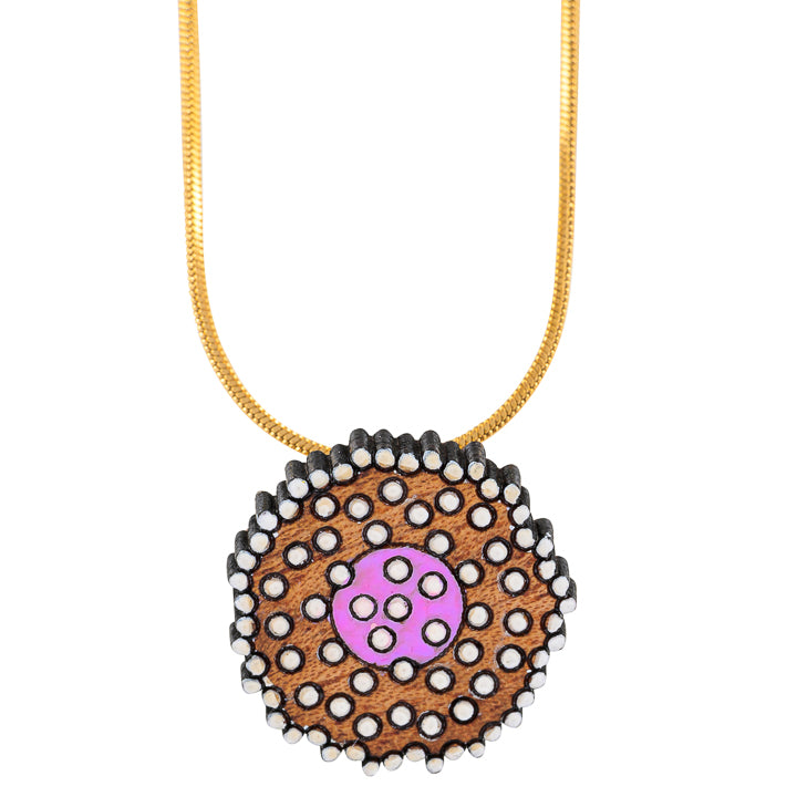 Paguro Upcycle reclaimed wood necklace with circular pendant featuring pink and white dot design on gold chain