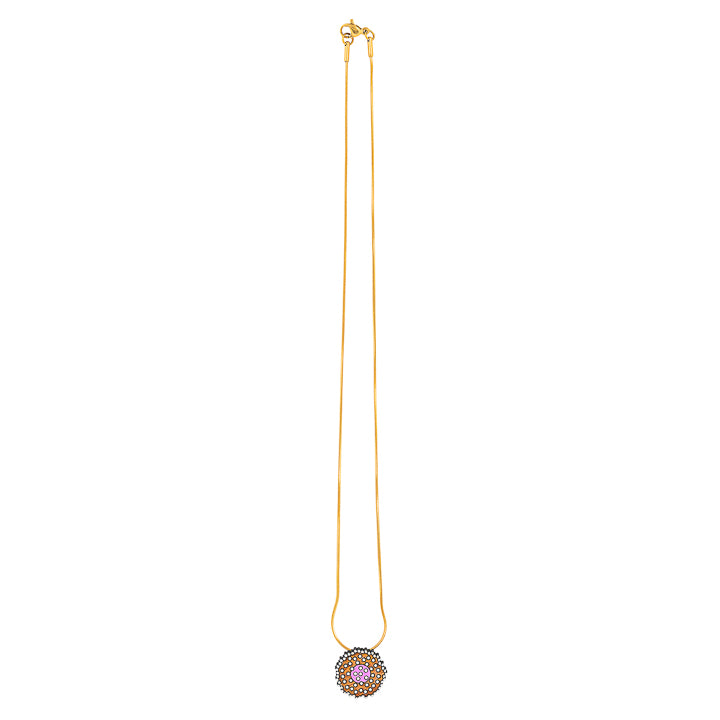 Paguro Upcycle reclaimed wood necklace with intricate circular pendant on a gold chain