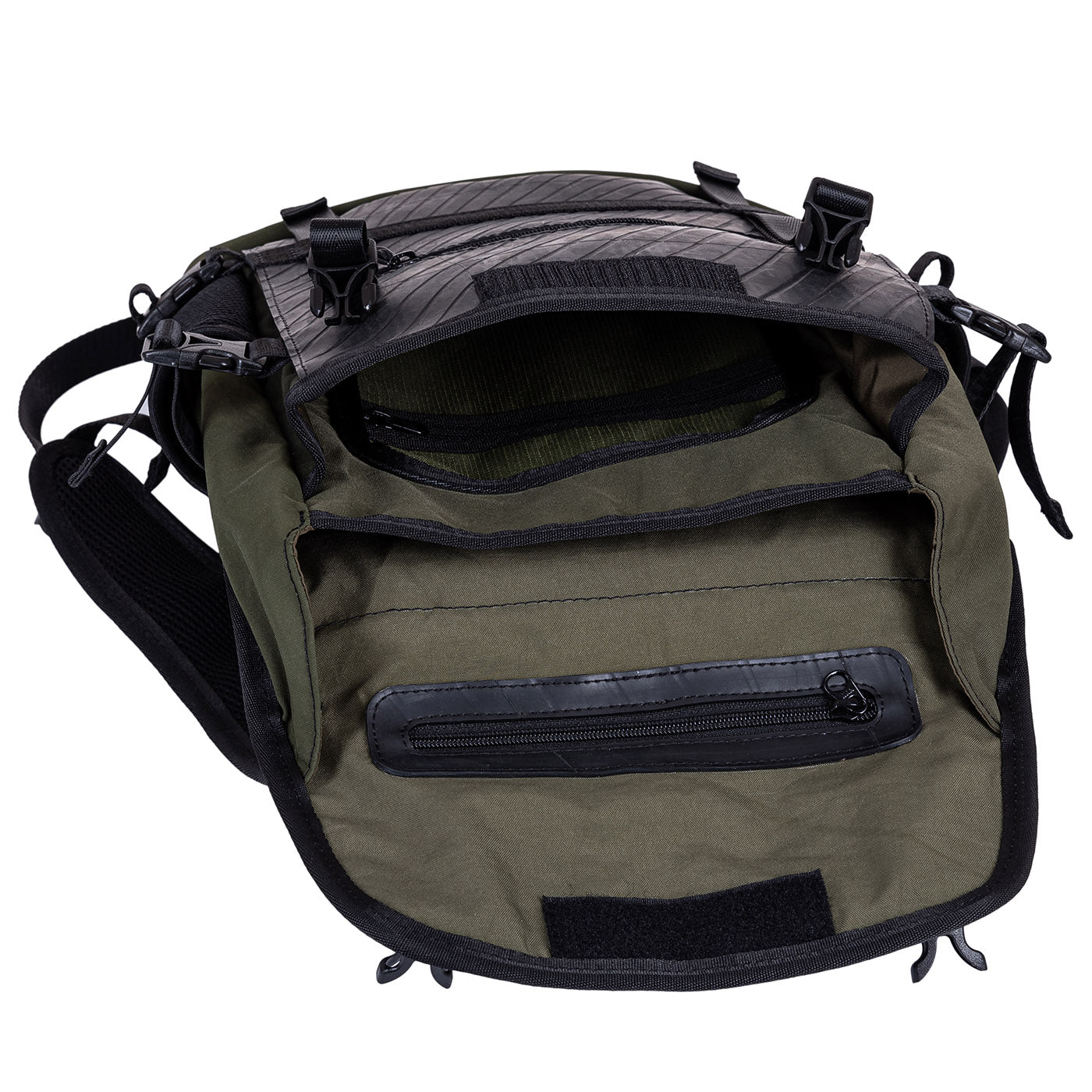 Open green and black backpack showing interior compartments and zippers.