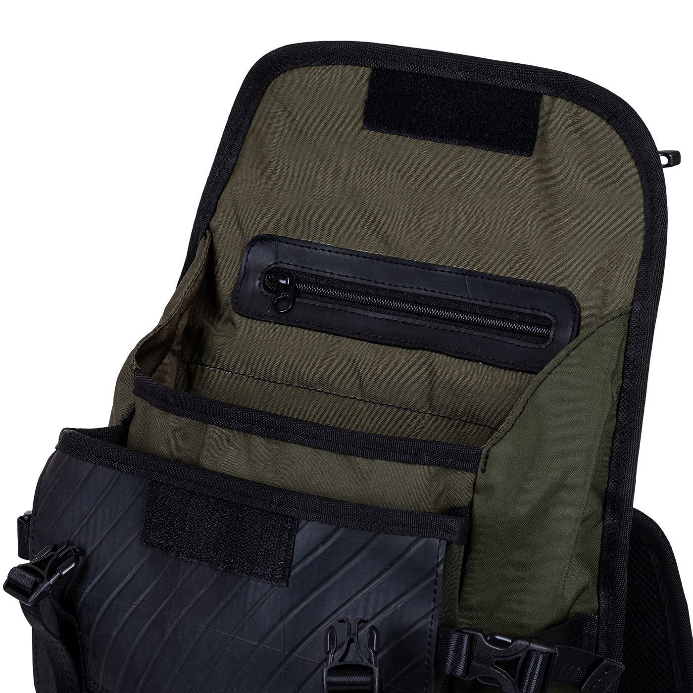 Open backpack showing interior compartments and zipper pocket.