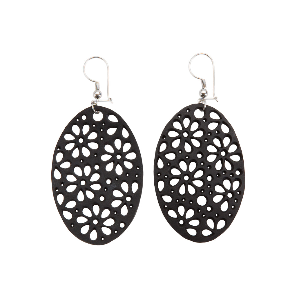 Paguro Upcycle black oval floral cutout drop earrings on silver hooks recycled rubber earrings UK