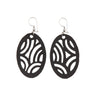 Paguro Upcycle black oval dangle recycled rubber earrings with carved wave cutout pattern and fishhook wires