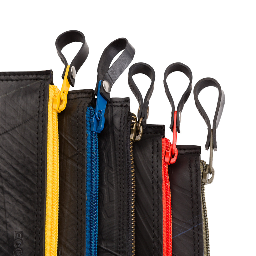 Paguro Upcycle vegan flat pouch bag set with colorful zippers and black recycled material travel pouches
