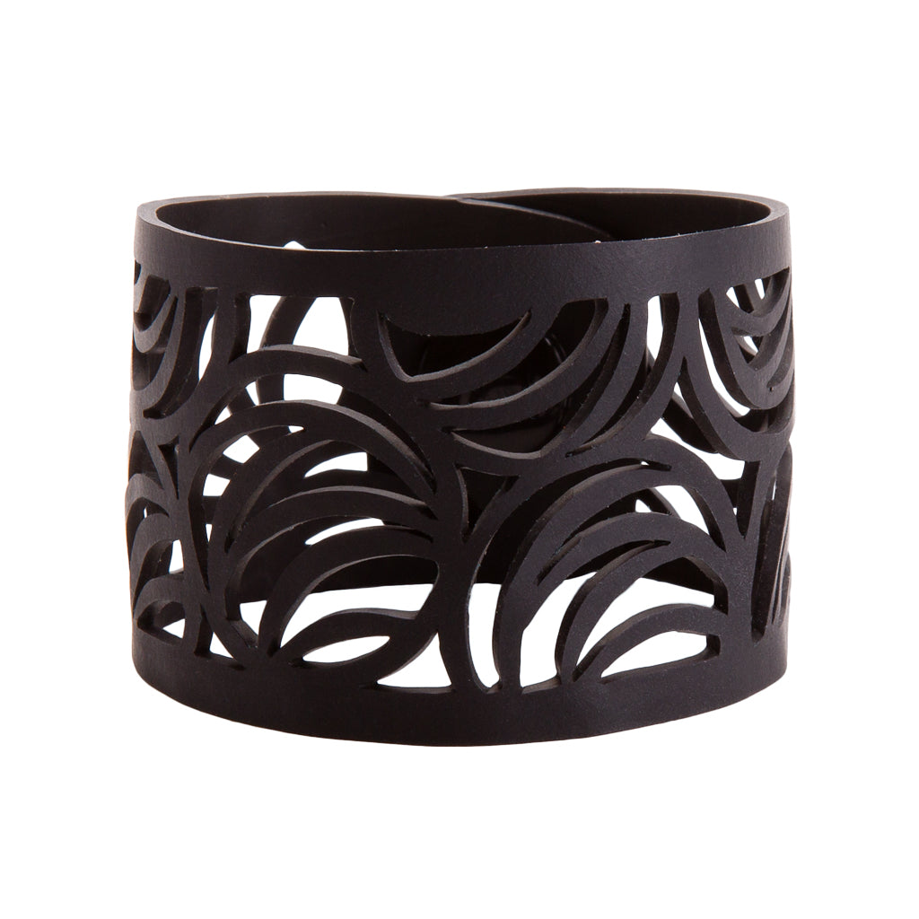 Paguro Upcycle black laser cut cuff recycled rubber bracelet with wide swirl cutout pattern for sustainable style