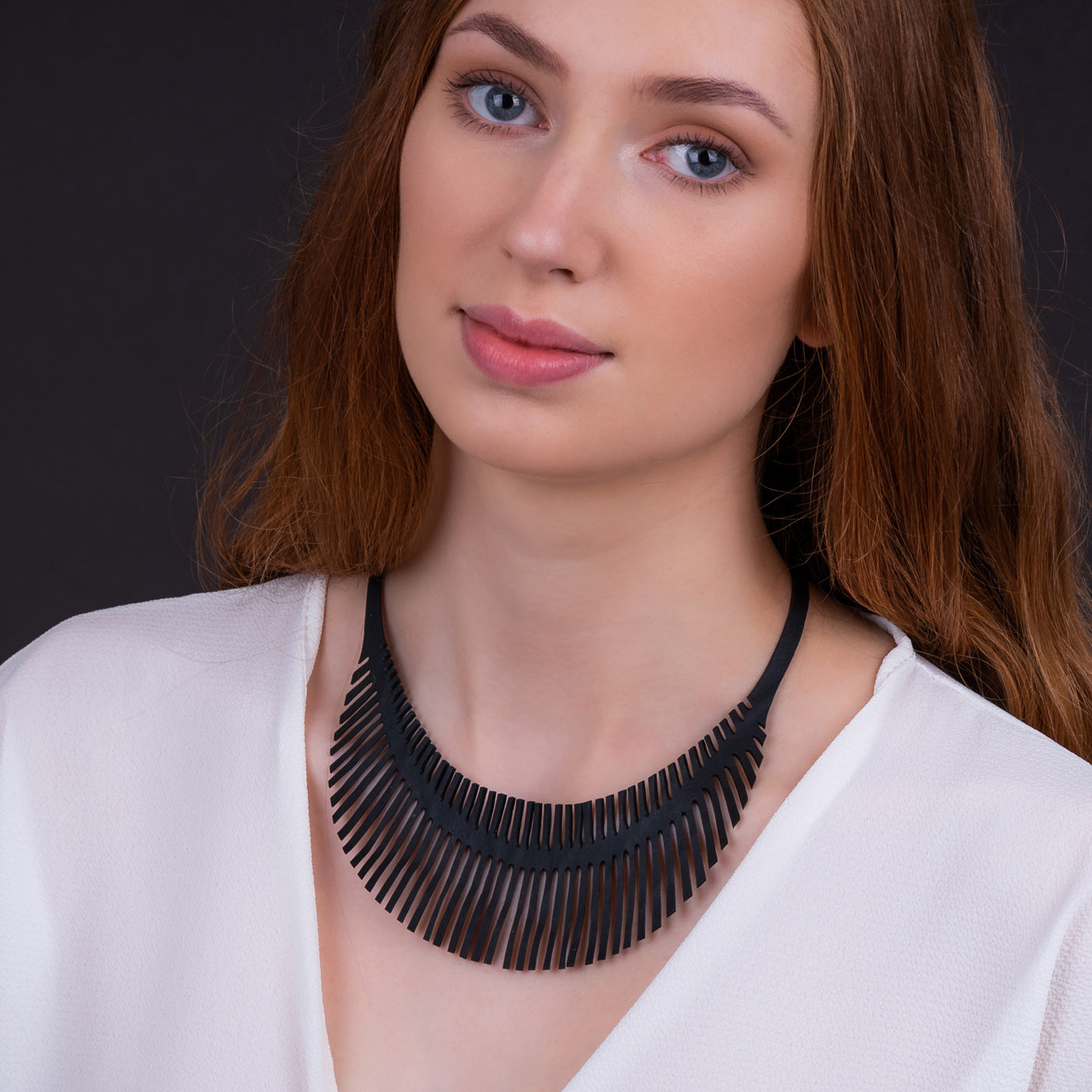 Paguro Upcycle upcycled inner tube necklace black fan statement necklace worn on model for casual wear