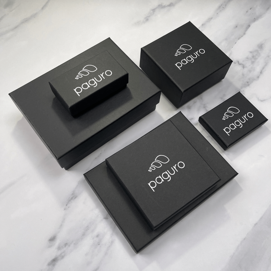 Paguro Upcycle black packaging boxes for wallets and money clips featuring vegan long zip purse branding