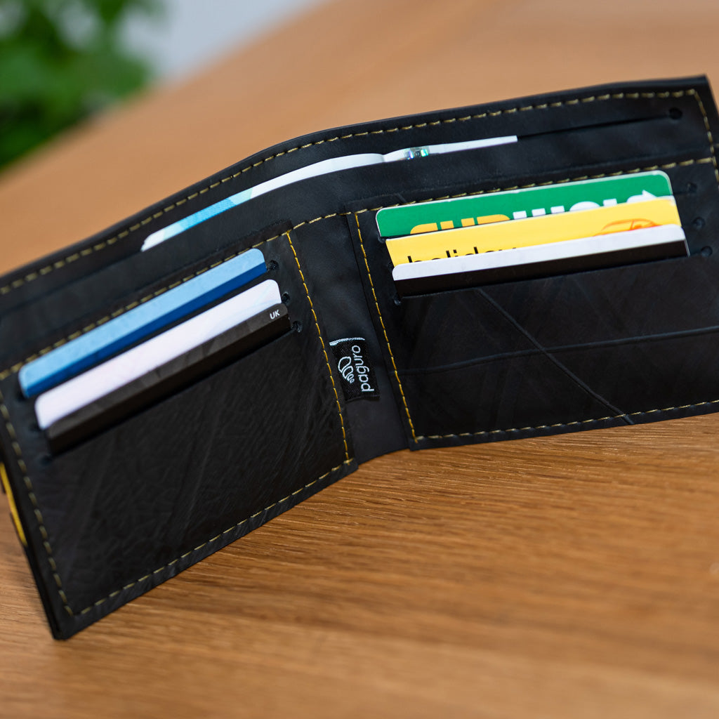 Paguro Upcycle vegan wallet made from inner tube with multiple card slots on wooden surface