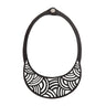 Paguro Upcycle upcycled inner tube necklace black cutout bib design with geometric wave pattern and snap closure