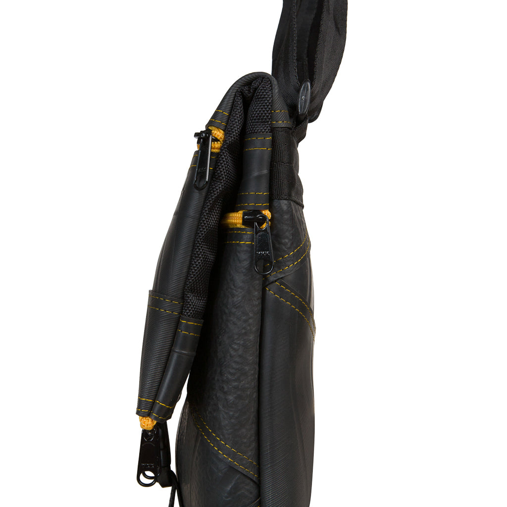 Paguro Upcycle black recycled rubber crossbody bag with yellow stitching and zipper details