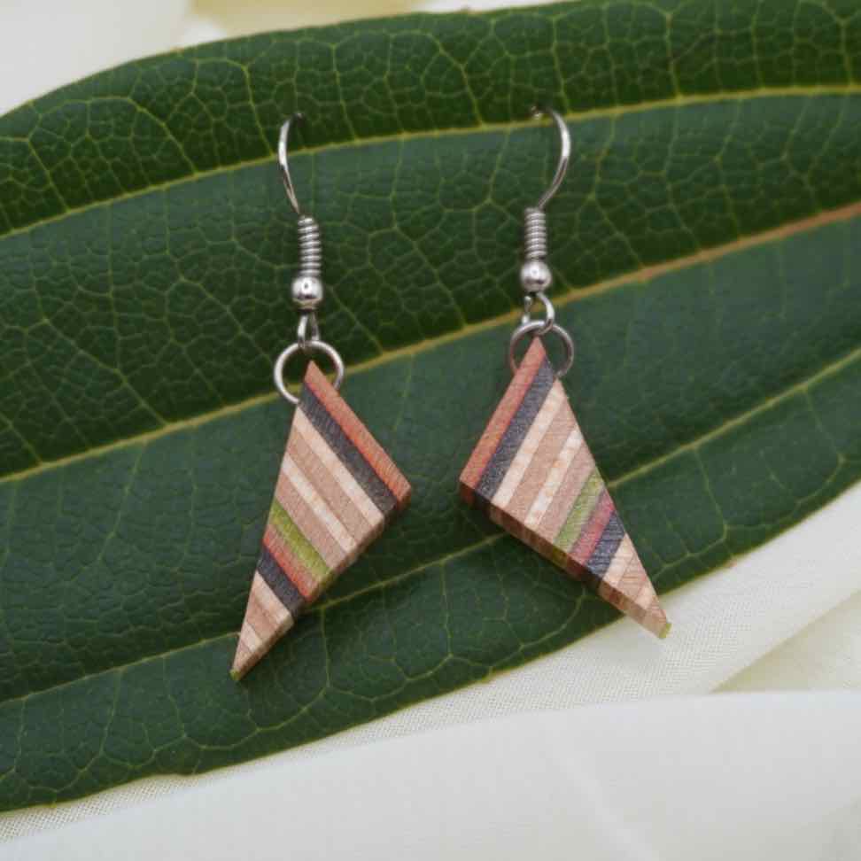 Paguro Upcycle upcycled skateboard earrings featuring triangular wooden design with colorful striped pattern