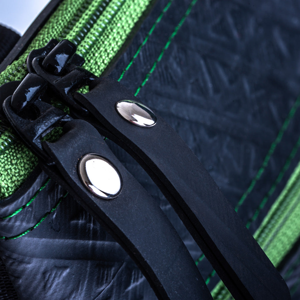Close-up of Paguro Upcycle upcycled vegan crossbody bag black zipper and green stitching details