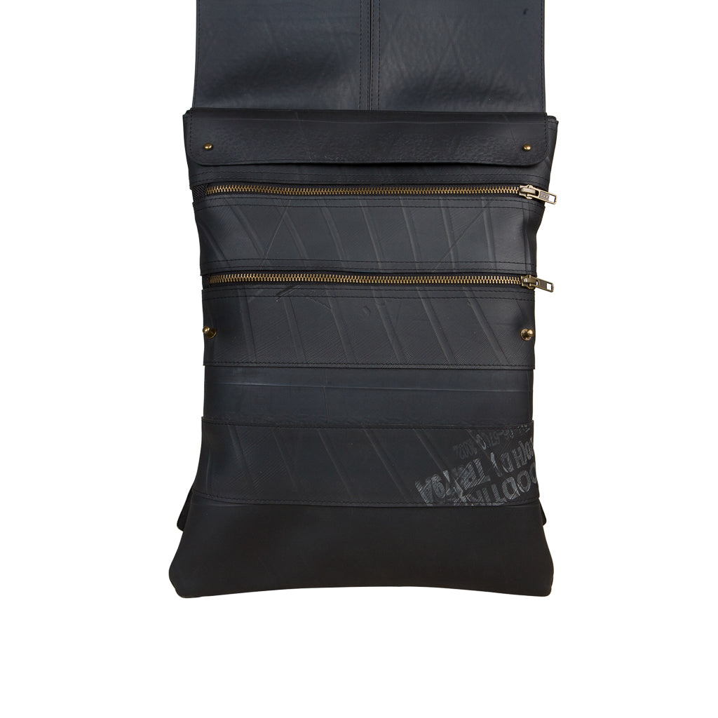 Paguro Upcycle vegan inner tube backpack in black with zipper pockets and fold-over top