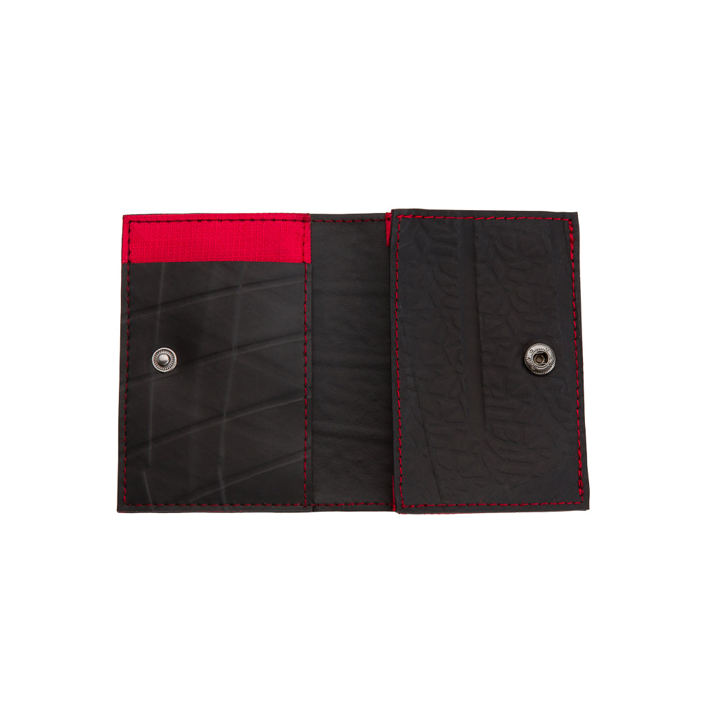 Paguro Upcycle vegan slim card holder in black with red stitching and snap button closure