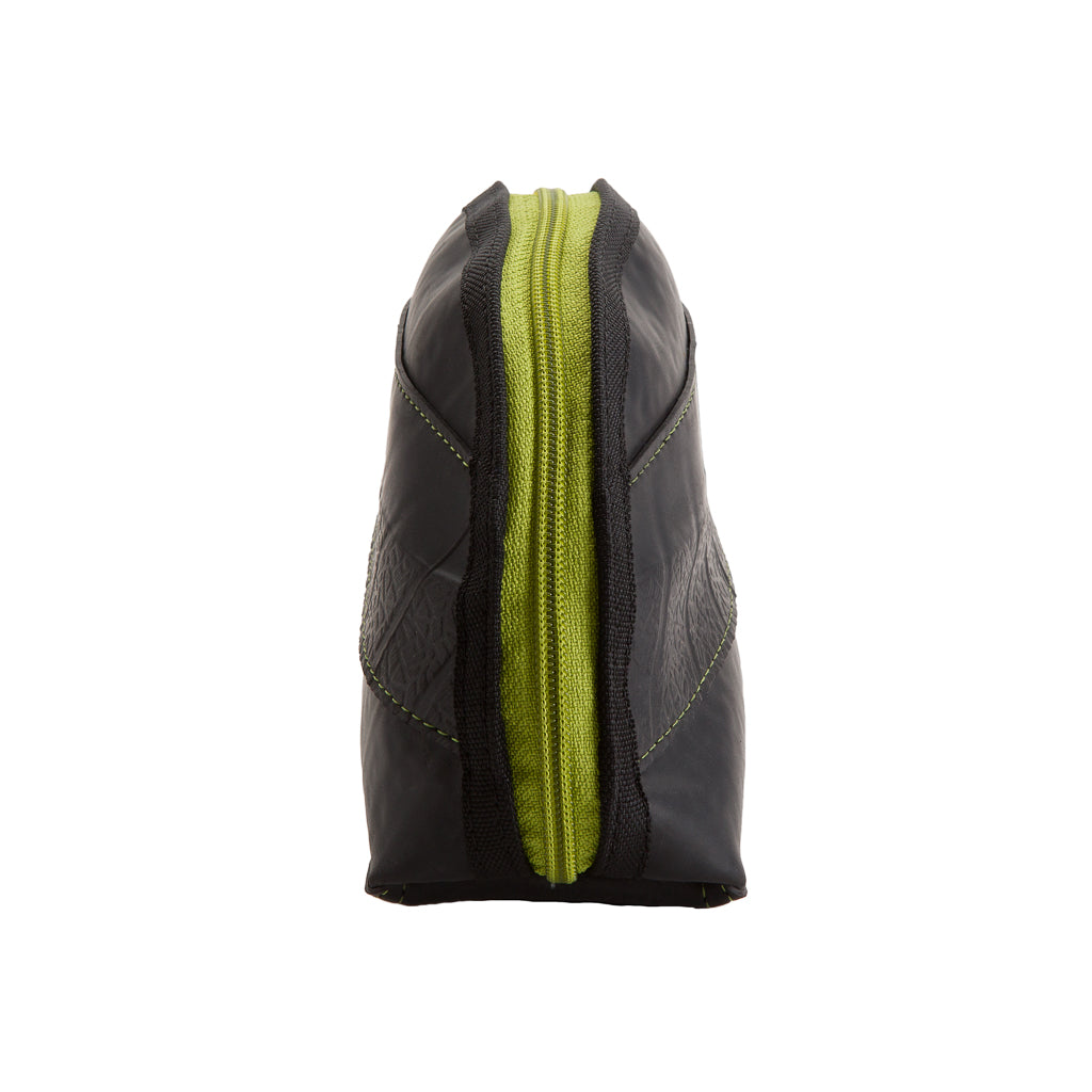 Side view of Paguro Upcycle black cosmetic bag with green zipper, vegan travel pouch for toiletries